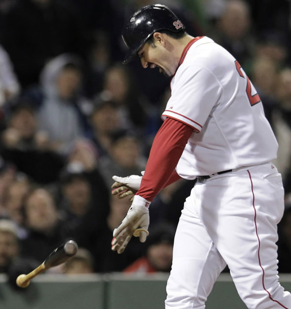 Adrian Gonzalez yells and tosses his bat after striking out and leaving the bases loaded in the seventh inning against the Oakland Athletics in a baseball game at Fenway Park in Boston, Wednesday, May 2, 2012.