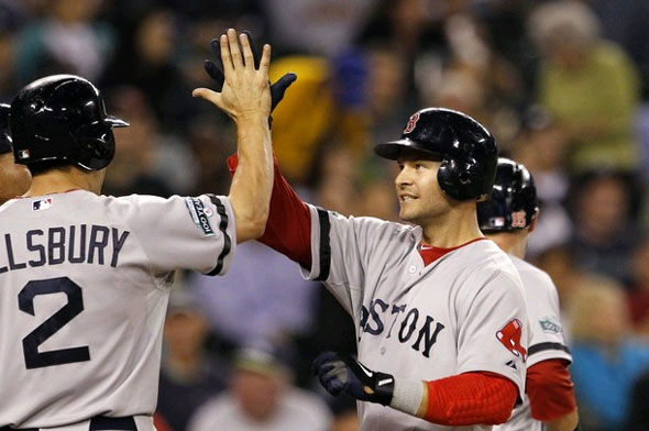 Cody Ross, right, is congratulated by Jacoby Ellsbury on Ross' three-run home run against the Seattle Mariners in the sixth inning of a baseball game Tuesday, Sept. 4, 2012, in Seattle.
