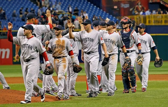The Boston Red Sox celebrate a victory over the Tampa Bay Rays at Tropicana Field on May 17, 2012 in St. Petersburg, Florida.