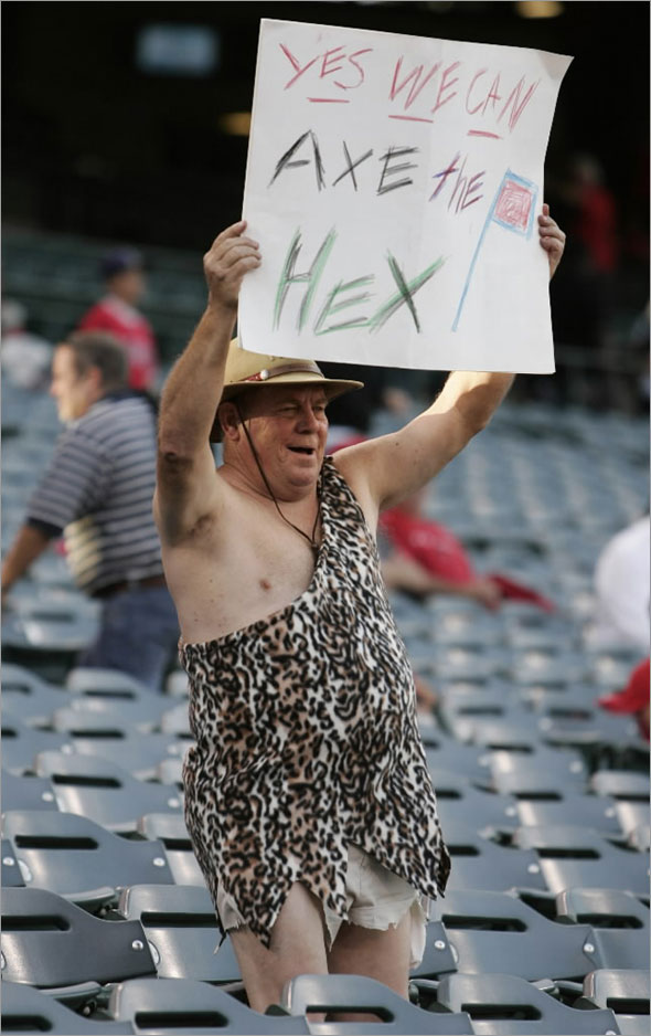 A fan holds a sign before the MLB American League Division Series playoff baseball game between the Los Angeles Angels and the Boston Red Sox in Anaheim, California October 9, 2009