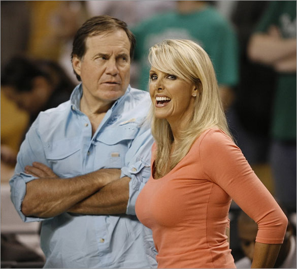 Patriots head coach Bill Belichick and his girlfriend Linda Holliday watch as the Boston Celtics and the Detroit Pistons warm-up before Game 5 of the NBA Eastern Conference basketball finals in Boston, Wednesday, May 28, 2008.