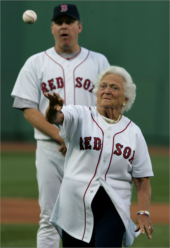 Former First Lady Barbara Bush threw out a ceremonial first pitch prior to the game, as Red Sox pitcher Curt Schilling, who had escorted her to the mound looks on from behind. 