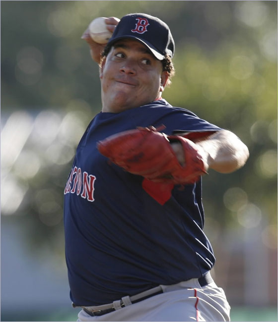 Red Sox pitcher Bartolo Colon throws a pitch to a batter during a live batting practice session at baseball spring training workouts at City of Palms Park in Fort Myers, Fla., Sunday, March 9, 2008. Colon is scheduled to see his first game action of the spring on Thursday.