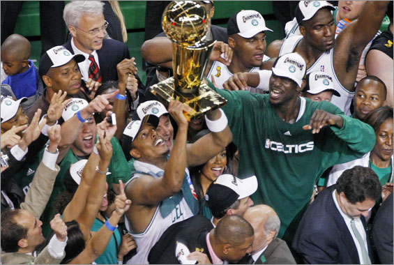 The Boston Celtics defeated the Los Angeles Lakers to win the NBA Finals four games to two, and in the process, wrapped up the franchise's seventeenth NBA Championship. Here Paul Pierce, with Kevin Garnett at right holds up the trophy. 