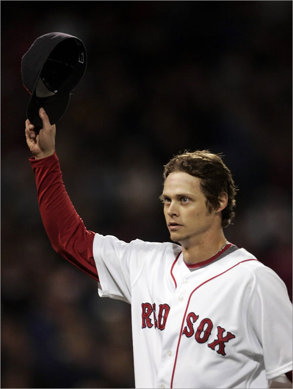 Clay Buchholz tips his cap to the crowd as he comes out of the game in the ninth inning