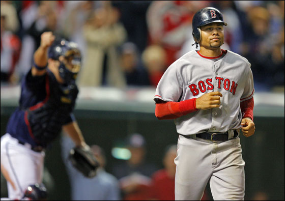 Cleveland, Ohio: Indians catcher Kelly Shoppach rejoices in the background after the Red Sox Coco Crisp lined out to first base to end the game. 
