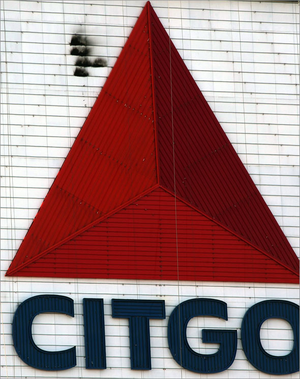 A small fire charred part of the huge Citgo sign near the top of red triangle  in Kenmore Square in the early afternoon.