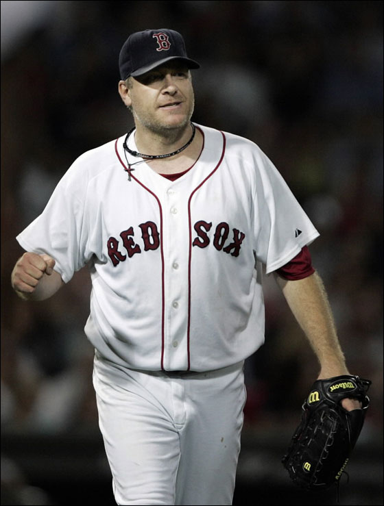 Boston Red Sox pitcher Curt Schilling pumps his fist after the Red Sox made an inning ending double play against the Oakland Athletics during the fifth inning of their American League MLB baseball game at Fenway Park in Boston, Massachusetts September 25, 2007.