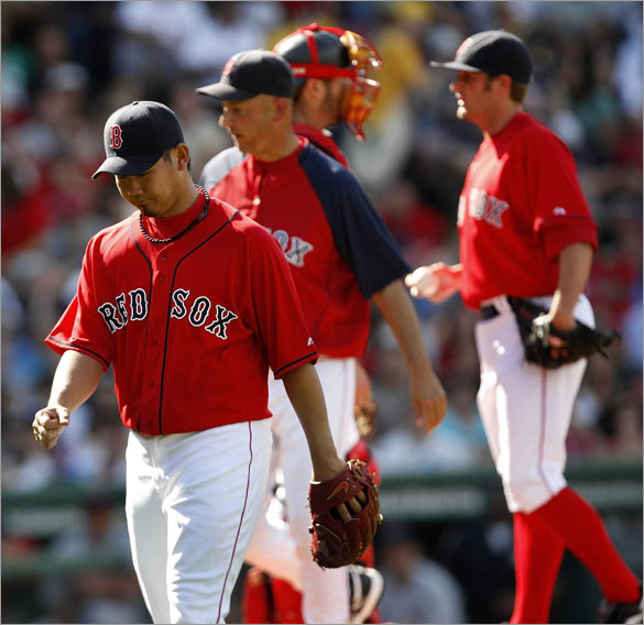 Red Sox pitcher Daisuke Matsuzaka leaves the mound after only lasting an inning and a half in his first start since going on the disabled list.  Matsuzaka was relieved by pitcher Chris Smith. 