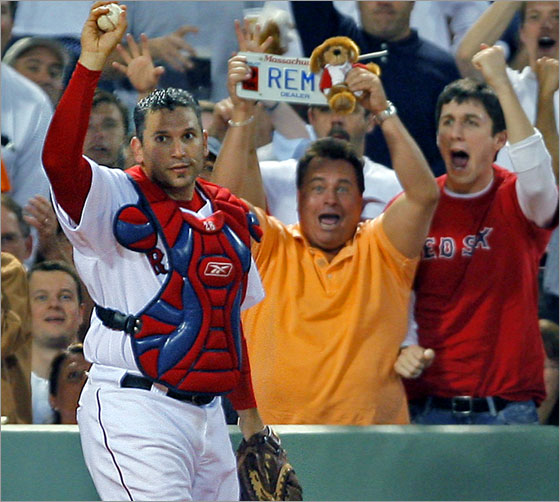 05/15/2007: Red Sox catcher Doug Mirabelli made a nice play on a fifth inning foul ball off the bat of Detroit's Gary Sheffield, as he battled the fans (A), had the ball pop out of his mitt, but he caught it barehanded after it came out (B), and he held it up foir the umpire (and the astonished fans) to see (C).