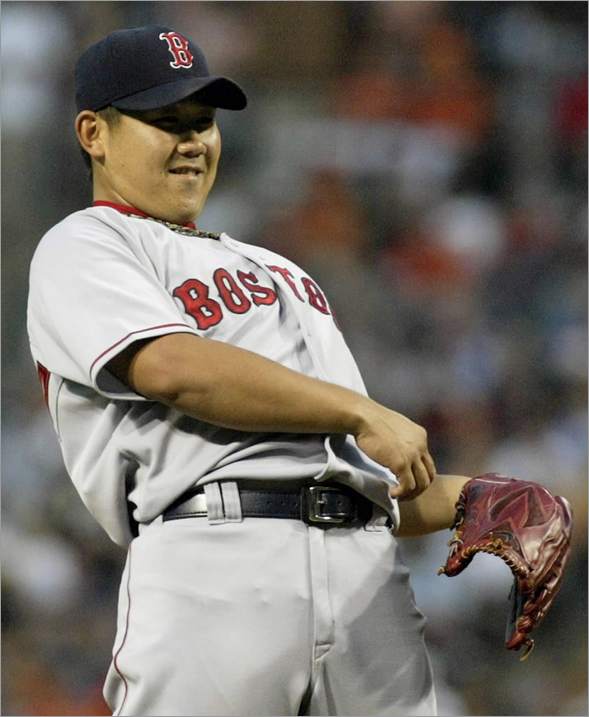 Daisuke Matsuzaka reacts after walking Baltimore Orioles batter Luke Scott in the second inning of their MLB American League base baseball game in Baltimore, Maryland August 19, 2008.