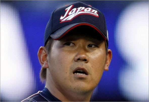 Team Japan's starting pitcher Daisuke Matsuzaka walks to the dugout after he was pulled from the game in the fifth inning against Team USA during the semifinal game at the World Baseball Classic in Los Angeles, California March 22, 2009.