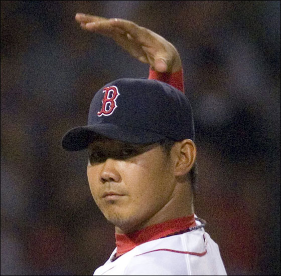 Red Sox Daisuke Matsuzaka stretches his arm while pitching  to the Toronto Blue Jays in the fifth inning of their  MLB American League baseball game at Fenway Park in Boston, Massachusetts September 3, 2007.