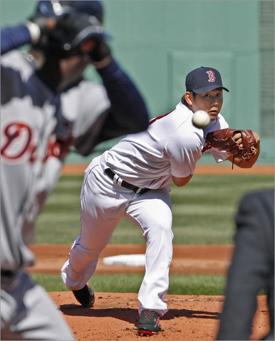 Red Sox starting pitcher Daisuke Matsuzaka fires the first pitch of the Fenway Park season to the Tigers Edgar Renteria.