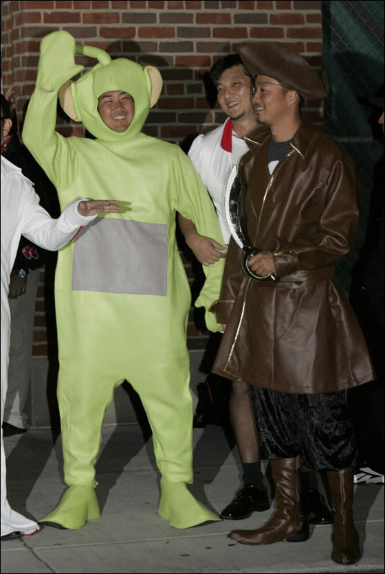 Red Sox pitchers Daisuke Matsuzaka, left in Teletubby costume, and Hideki Okajima, right in pirates costume, are seen after a game at Fenway Park in Boston Sunday, Sept. 16, 2007 before leaving for Toronto. Many teams use a late season trip as a chance to have some fun with the rookies, dressing them in outlandish costumes that must be worn on a road trip