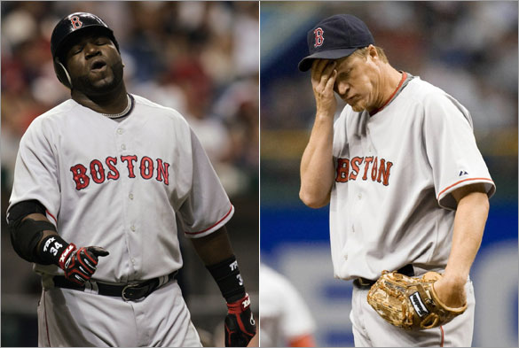 Boston Red Sox's David Ortiz reacts after flying out with two runners on base during the ninth-inning against the Tampa Bay Rays in a baseball game Friday night April 25, 2008, in St. Petersburg, Fla. Red Sox pitcher Mike Timlin wipes his brow during the 11th inning. The Rays won the game 5-4 in 11-innings.