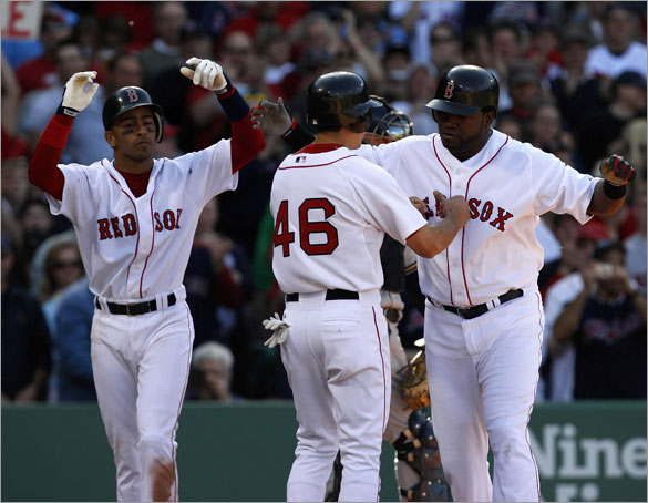  Red Sox DH David Ortiz is greeted at home by Julio Lugo and Jacoby Ellsbury after his 3 run homer in the 2nd. 