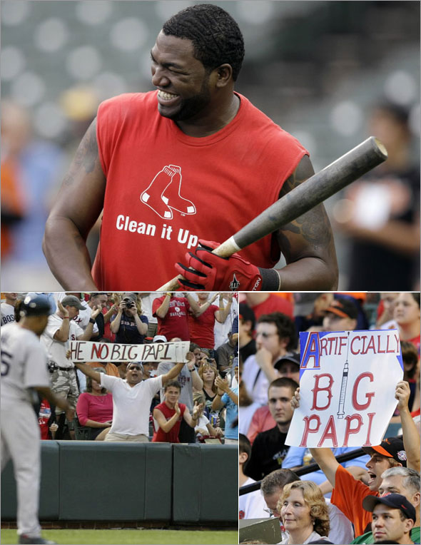 David Ortiz loosens up before the start of a baseball game against the Baltimore Orioles, and fans react with signs over the weekend