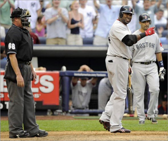 Boston Red Sox batter David Ortiz reacts after umpire Jim Joyce called him out on strikes with two runners on base against the New York Yankees in the seventh inning of their MLB American League baseball game at Yankee Stadium in New York August 8, 2009.