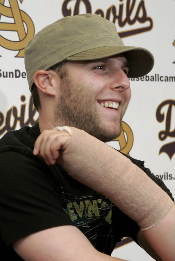Dustin Pedroia, an infielder for the Boston Red Sox, smiles during a news conference after being named American League Rookie of the Year on Monday, Nov. 12, 2007 in Tempe, Ariz. The cast on Pedroia's left wrist is a result of cracked bone suffered during the season.