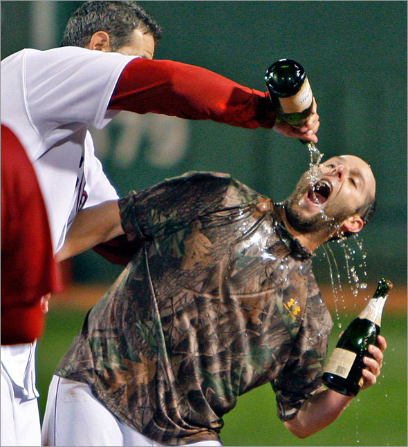 9.23.08: Dustin Pedroia (right) celebrating on the field with teammate Mike Lowell (left) after the Red Sox defeated the Indians to clinch a playoff berth.