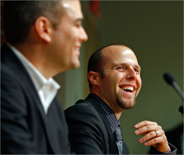 Red Sox second baseman Dustin Pedroia has over 40 million reasons to smile, as he is joined by GM Theo Epstein as they announce his new long term contract with the team.