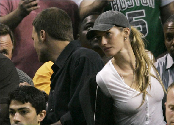 New England Patriots quarterback Tom Brady, left, and Gisele Bundchen take their seats at courtside in the first half during Game 2 of the NBA Eastern Conference basketball finals between the Boston Celtics and Detroit Pistons in Boston, Thursday, May 22, 2008. 