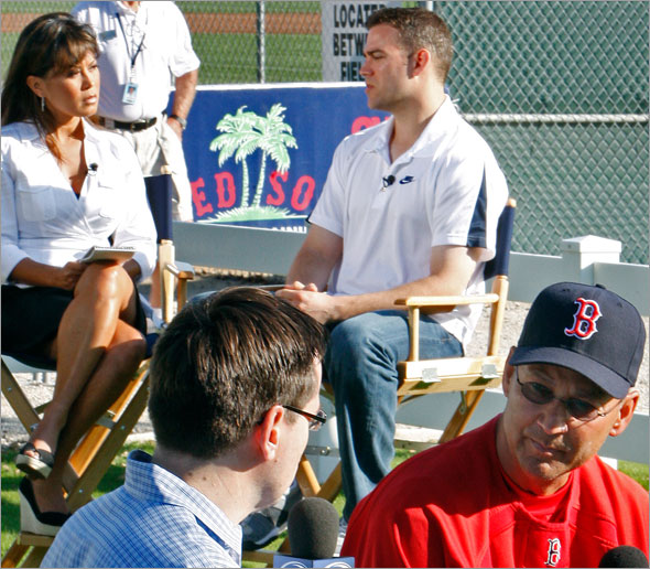 Red Sox brass were busy this morning doing interviews at the same time, as manager Terry Francona (front right) sits down with Gary Tanguay (front left) of Comcast Sportsnet, and GM Theo Epstein (back right) does the same with Hazel Mae (back left) of the MLB Network.