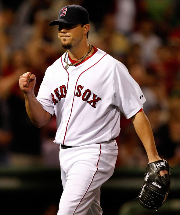 Boston Red Sox starting pitcher Josh Beckett was pumped after his inning ending play in the 8th.
