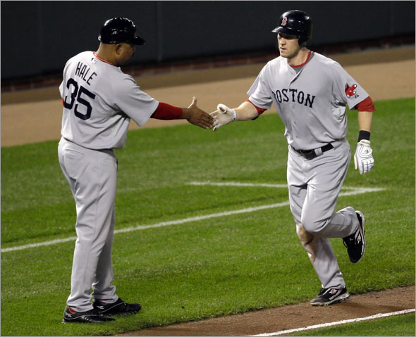 Jason Bay, right, is congratulated by third base coach DeMarlo Hale (35) after hitting a solo home run against the Baltimore Orioles during the fourth inning of a baseball game, Friday, Sept. 18, 2009, 