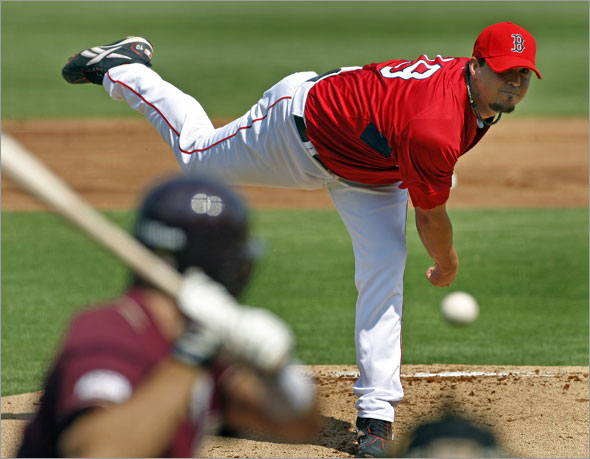  The Red Sox kicked off the Grapefruit League season with a game at City of Palms Park vs. Boston College. Red Sox starting pitcher Josh Beckett is shown as he fires a pitch to Boston College's Harry Darling in the top of the first inning.