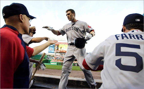 Boston Red Sox's Jason Bay, center, is congratulated by teammates after he hit a rome run during the second inning of a baseball game against the Washington Nationals, Tuesday, June 23, 2009, in Washington.