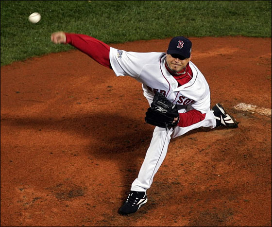 Starting pitcher Josh Beckett #19 of the Boston Red Sox winds up against the Colorado Rockies during Game One of the 2007 Major League Baseball World Series at Fenway Park on October 24, 2007 in Boston, Massachusetts.