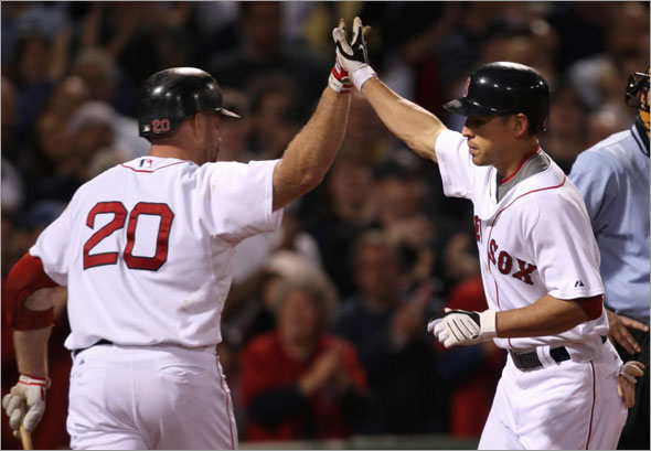 Red Sox vs. Florida Marlins: Jacoby Ellsbury high 5's with Kevin Youkilis after his home run in 7th inning.