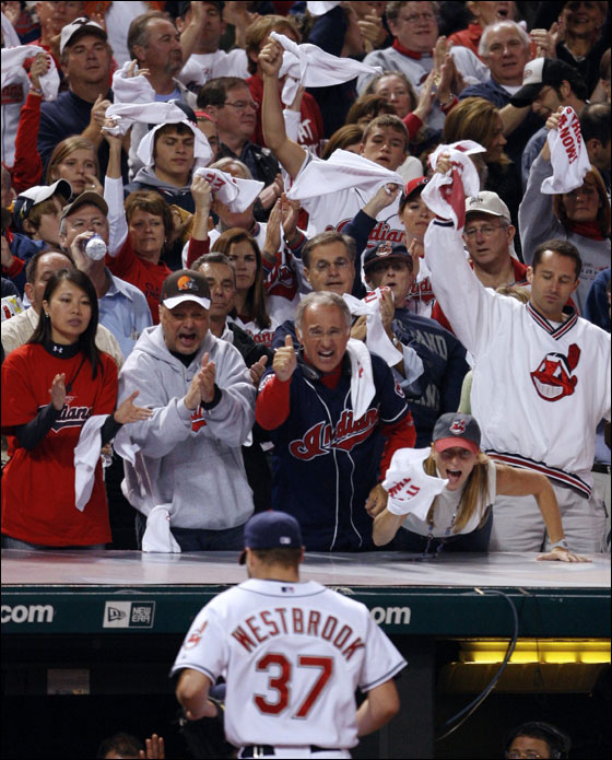 Fans cheer Cleveland Indians starting pitcher Jake Westbrook as he leaves the game during the seventh inning of Major League Baseball's ALCS playoff series against the Boston Red Sox in Cleveland October 15, 2007.