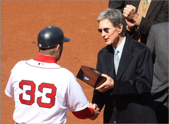 Red Sox catcher Jason Varitek, shown here receiving a World Series ring from principal owner John W. Henry during the ceremonies before the 2008 home opener, is meeting with the Sox owner