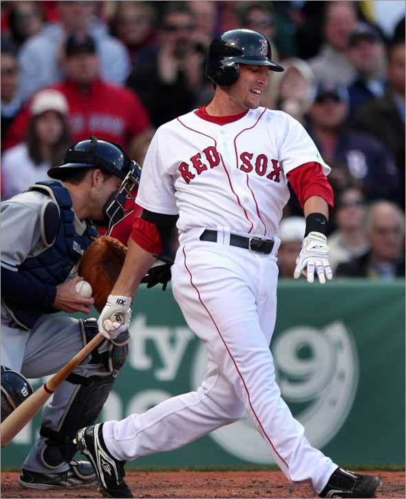 Jason Lowrie grimaces as he strikes out with two runners on in the 8th inning with Sox down 4-2. Boston Globe staff photo by John Tlumacki 