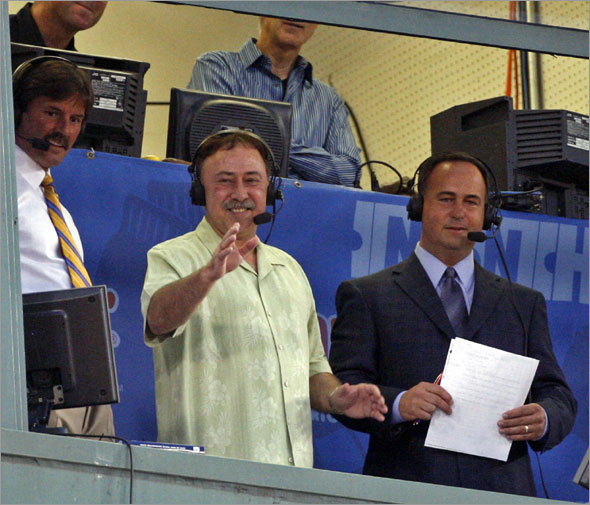 Red Sox announcer Jerry Remy waves to the crowd from the broadcast booth at Fenway Park during a baseball game against the Detroit Tigers in Boston Wednesday, Aug. 12, 2009. Remy said he hopes to be on the air soon after taking an indefinite leave of absence to recover from cancer surgery 