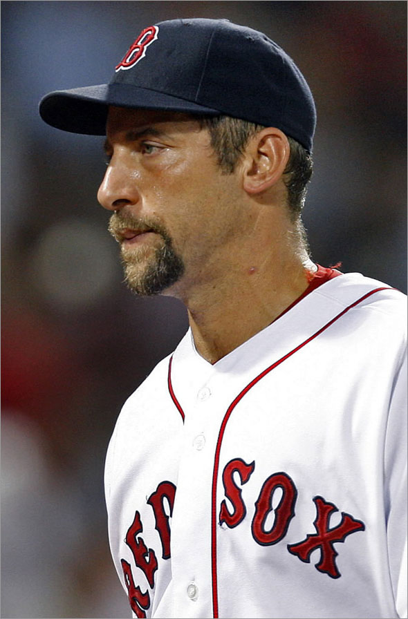 John Smoltz looks frustrated as as walks off the mound following the top of the sixth inning after giving up a run as Oakland lead 5-0. It would be his last appearance of the night. The Boston Red Sox play the Seattle Oakland Athletics at Fenway Park.