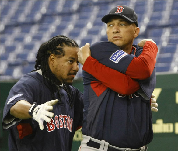 Red Sox slugger Manny Ramirez (L) plays with Julian Tavarez before a workout session at Tokyo Dome, March 21, 2008, ahead of their season-opening baseball games against the Oakland Athletics. The Red Sox will play the Athletics on March 25 and 26 in Japan.
