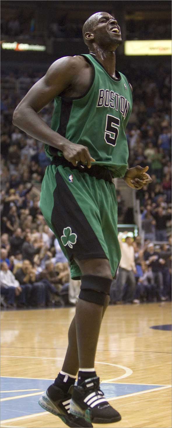 This is a Feb. 19, 2009, file photo showing Boston Celtics forward Kevin Garnett hopping in pain during the second quarter against the Utah Jazz in an NBA basketball game in Salt Lake City.