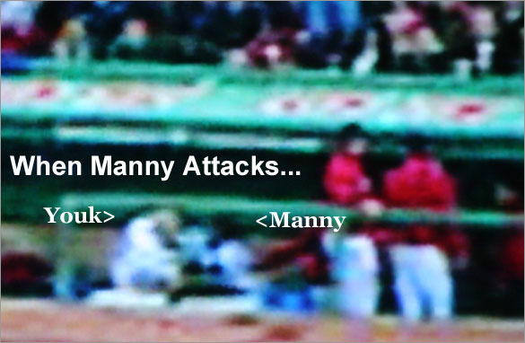 Manny charges Youk in the dugout after the fourth inning