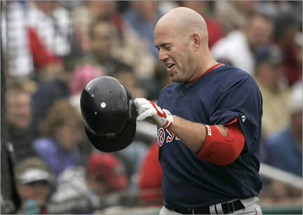 Boston Red Sox's Kevin Youkilis smiles as he heads toward the dugout after hitting a home run off Minnesota Twins pitcher Craig Breslow in the seventh inning of a spring training baseball game, in Fort Myers, Fla., Sunday, March 1, 2009. The Red Sox beat the Twins 2-1. 