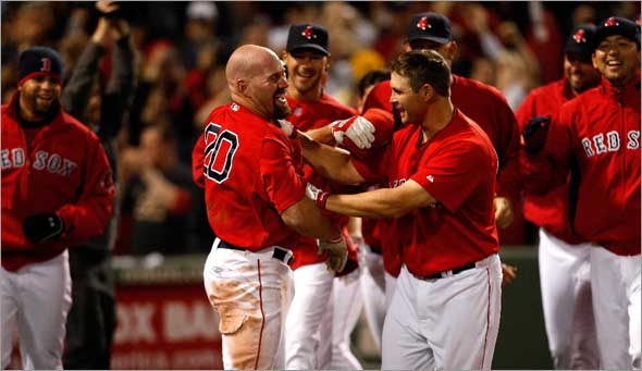Red Sox first baseman Kevin Youkilis is on the end of the receiving line after his walk off HR in the 11th.