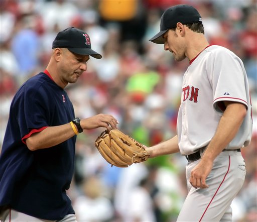 Boston Red Sox starting pitcher Lenny DiNardo gives up the ball to manager Terry Francona, left, in the third inning after giving up four runs on five hits to the Philadelphia Phillies in their baseball game Sunday, May 21, 2006, in Philadelphia. The Phillies beat the Red Sox 10-5.