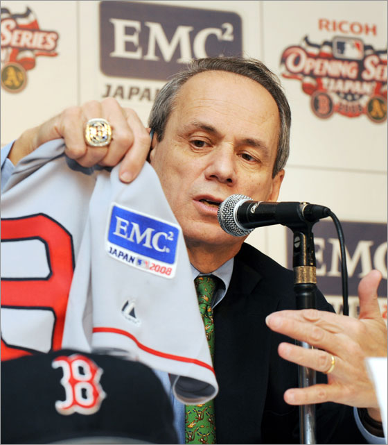Larry Lucchino (L), President/CEO of the 2007 World Series champion Boston Red Sox, introduces a baseball uniform with specially designed sleeve patches for the upcoming Ricoh Japan Opening Series 2008 during a news conference in Tokyo, 23 January 2008.  EMC Corporation, the world leader in information infrastructure solutions, announced a new partnership as an official sponsor on Major League Baseball Japan, and an expanded partnership with Boston Red Sox to support the Ricoh Japan Opening Series 2008. The series will be held here on 25-26 March against Oakland Athletics.