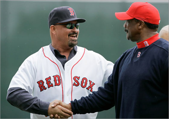 Former Boston Red Sox left fielder Mike Greenwell, left, shakes hands with former teammate Jim Rice after throwing out the ceremonial first pitch prior to the Red Sox-New York Mets spring training baseball game in Fort Myers, Fla., Tuesday March 11, 2008.