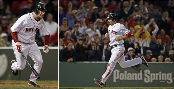 Mark Kotsay heads to first after hitting an RBI double to drive in Jeff Bailey (right) with the go-ahead run during the eighth inning against the Cleveland Indians at Fenway Park in Boston on Wednesday, Sept. 24, 2008. The Red Sox won 5-4.