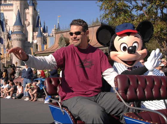 Boston Red Sox third baseman Mike Lowell celebrates his 2007 World Series MVP award with Mickey Mouse, Friday, Nov. 16, 2007 at the Magic Kingdom. in Lake Buena Visa, Fla. Lowell served as the grand marshal in the Disney Dreams Come True Parade.