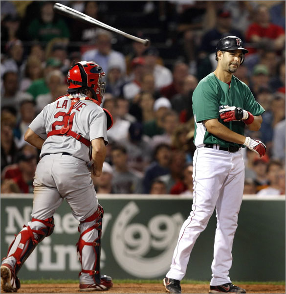A frustrated Mike Lowell tosses his bat after striking out in the 7th to end the inning.